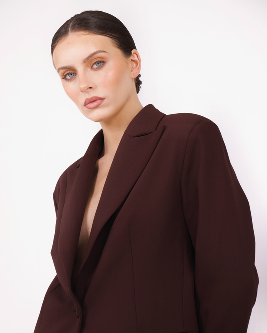 Model wearing BOLDNSUBTLE's oversized blazer in brown. A tailored minimalist silhouette with structured lapels and full lining.